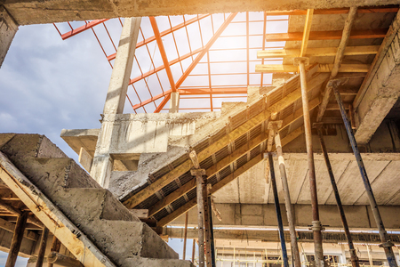 New house construction interior with concrete staircase at building siteの写真素材