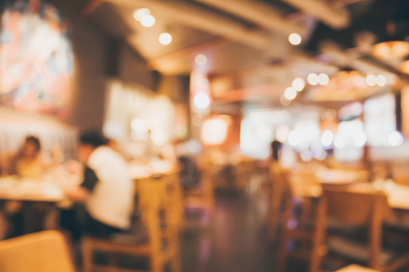 Restaurant cafe or coffee shop interior with people abstract defocused blur backgroundの写真素材