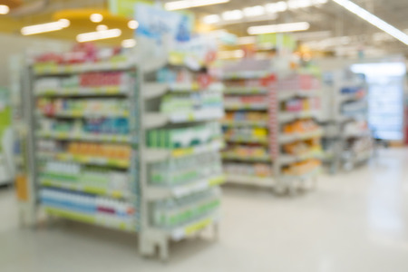 pharmacy drugstore shop interior with medicines vitamins supplement and over the counter healthcare product for healthy on shelves blur backgroundの写真素材