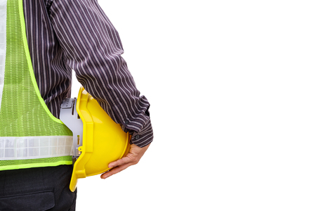 young business man professional engineer worker with blueprint and safety helmet isolated on white backgroundの写真素材