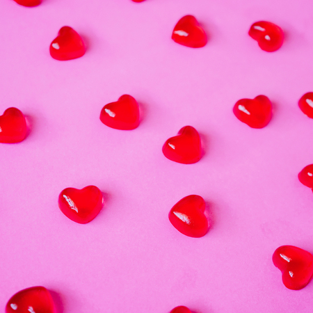 Valentines day background with heart shape candy on pink backgroundの写真素材
