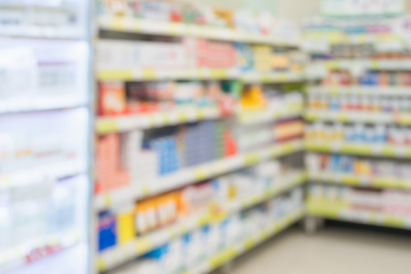 pharmacy drugstore shop interior with medicines vitamins supplement and over the counter healthcare product for healthy on shelves blur backgroundの写真素材