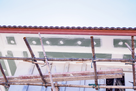 Soffit and Fascia Board Installation at House Building Construction Siteの写真素材