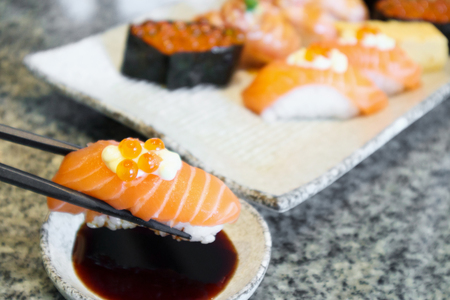 salmon sashimi sushi roll set with chopsticks on plate Japanese foodの写真素材