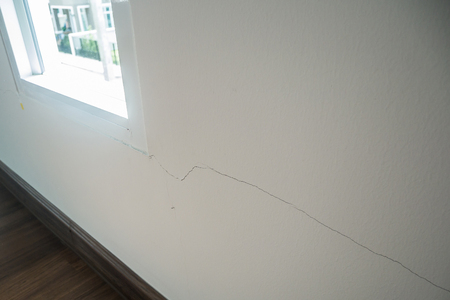 cracked on wall background close upの写真素材