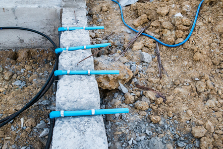 Pest control pipe system install at new house construction foundation for termite protectionの写真素材