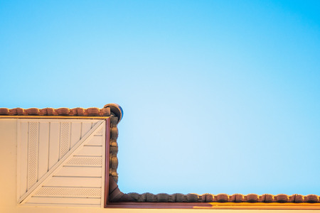 Soffit Board Installation with blue skyの写真素材