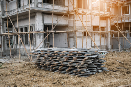installation of cement formwork frames to new house construction at building site, real estate developmentの写真素材