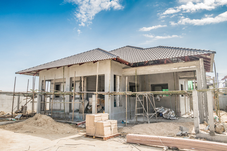 construction residential new house in progress at building siteの写真素材
