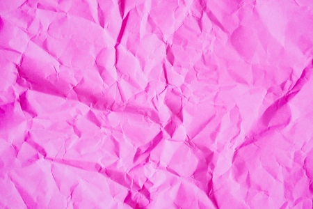 Crumpled pink paper texture backgroundの写真素材