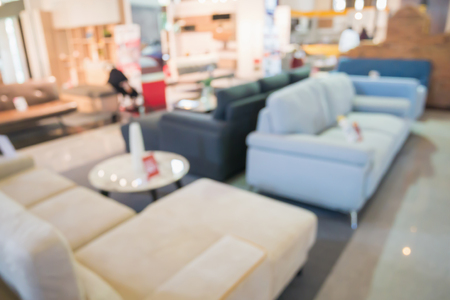 Abstract blur sofa in home decor furniture showroom store interior with bokeh light background for montage product displayの写真素材