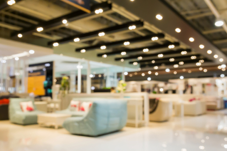 Abstract blur sofa in home decor furniture showroom store interior with bokeh light background for montage product displayの写真素材
