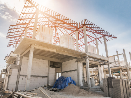 construction residential new house in progress at building siteの写真素材