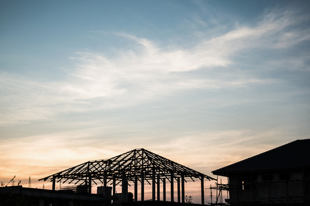 silhouette house building at construction site sunset backgroundの写真素材