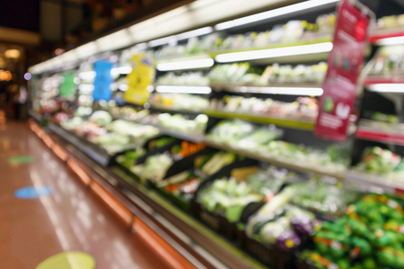abstract blur organic fresh fruits and vegetable on grocery shelves in supermarket store defocused bokeh light backgroundの写真素材