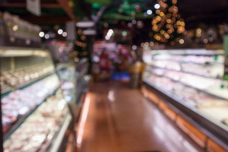 Abstract supermarket grocery store blurred defocused background with bokeh lightの写真素材