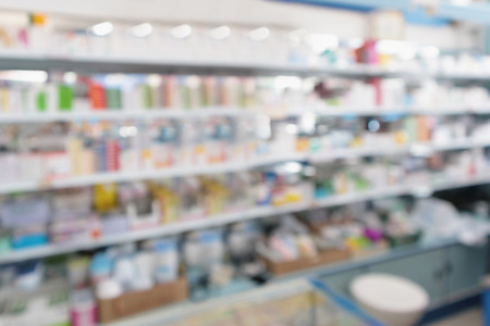 pharmacy drugstore shop interior with medicines vitamins supplement and over the counter healthcare product for healthy on shelves blur backgroundの写真素材