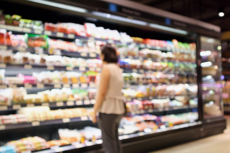 Abstract supermarket grocery store blurred defocused background with bokeh lightの写真素材