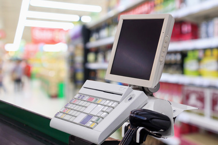 supermarket checkout cash desk counter with payment terminal の写真素材