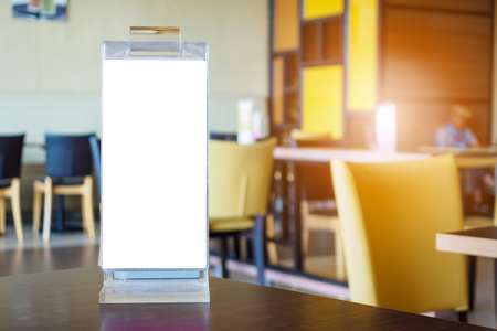 Mock up Blank white menu frame on cafe restaurant tableの写真素材