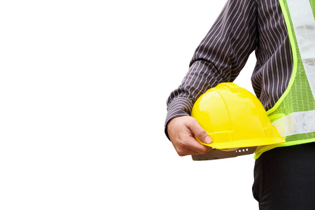 young business man professional engineer worker with blueprint and safety helmet isolated on white backgroundの写真素材