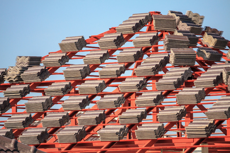 Roof house construction with lots of tile prepare to Installの写真素材