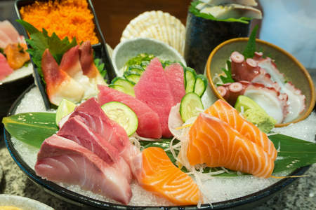 Sashimi set with salmon tuna on iceの写真素材