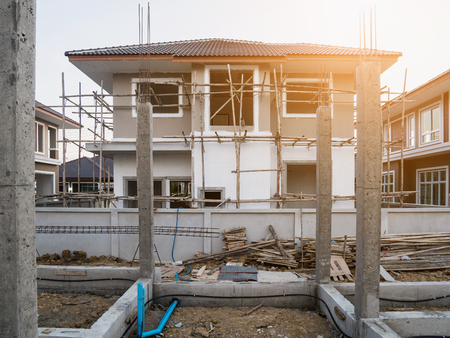 construction residential new house in progress at building siteの写真素材