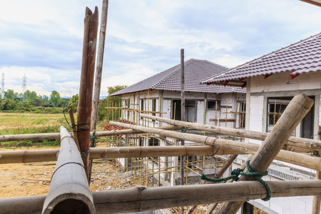 construction residential new house in progress at building siteの写真素材