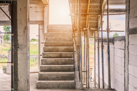 New house construction interior with concrete staircase at building siteの写真素材