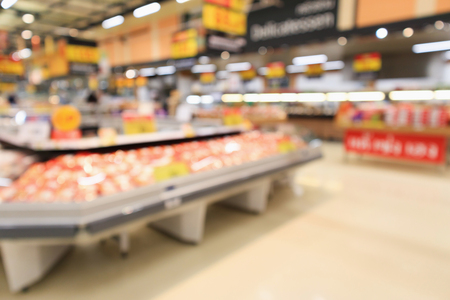 Abstract supermarket grocery store blurred defocused background with bokeh lightの写真素材