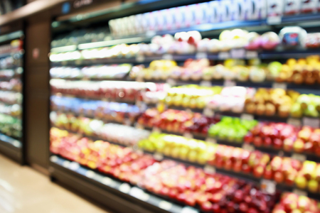 abstract blur organic fresh fruits and vegetable on grocery shelves in supermarket store defocused bokeh light backgroundの写真素材