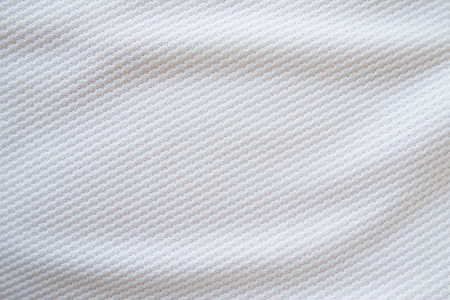White football jersey clothing fabric texture sports wear background, close upの写真素材