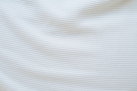 White football jersey clothing fabric texture sports wear background, close upの写真素材