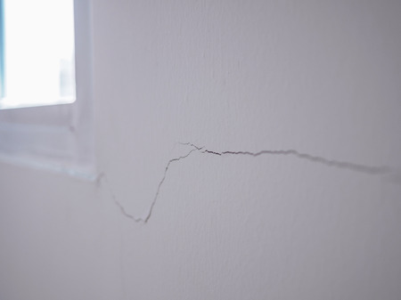 cracked on wall background close upの写真素材
