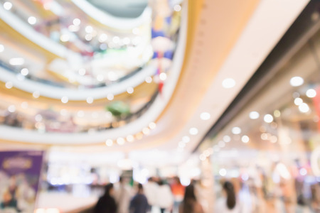 Abstract blur people in modern shopping mall interior defocused backgroundの写真素材