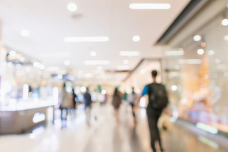 Abstract blur people in modern shopping mall interior defocused backgroundの写真素材