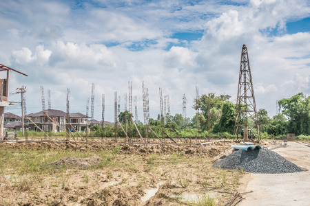 pile driver at house building construction siteの写真素材