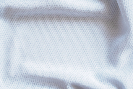 White football jersey clothing fabric texture sports wear background, close upの写真素材