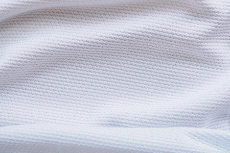 White football jersey clothing fabric texture sports wear background, close upの写真素材