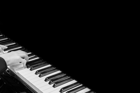 Close up musician hand playing pianoの写真素材