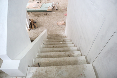 New house construction interior with concrete staircase at building siteの写真素材