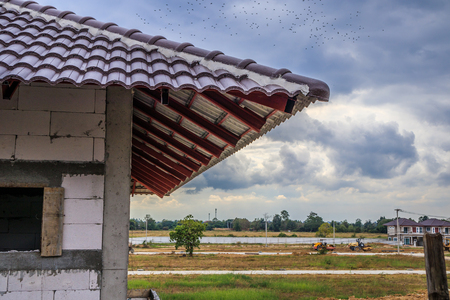 House roof construction at building siteの写真素材