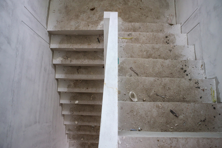 New house construction interior with concrete staircase at building siteの写真素材