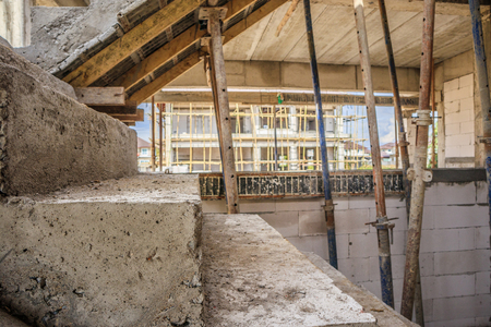 New house construction interior with concrete staircase at building siteの写真素材