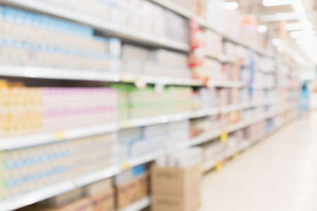 Abstract blur supermarket discount store product shelves interior defocused backgroundの写真素材