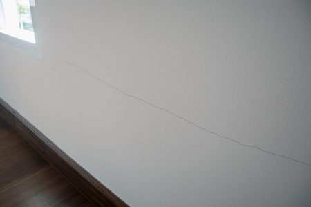 cracked on wall background close upの写真素材