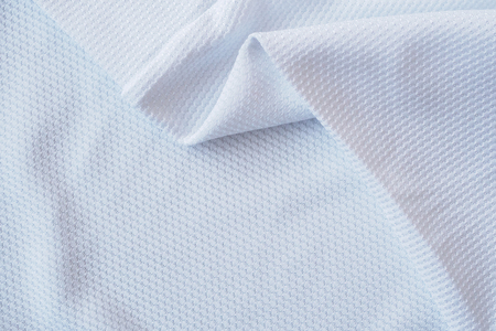 White football jersey clothing fabric texture sports wear background, close upの写真素材