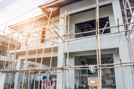 construction residential new house in progress at building siteの写真素材