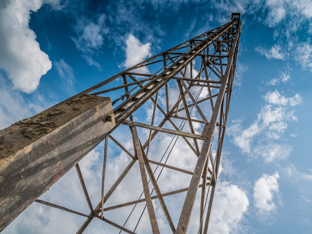 pile driver with clouds and blue skyの写真素材